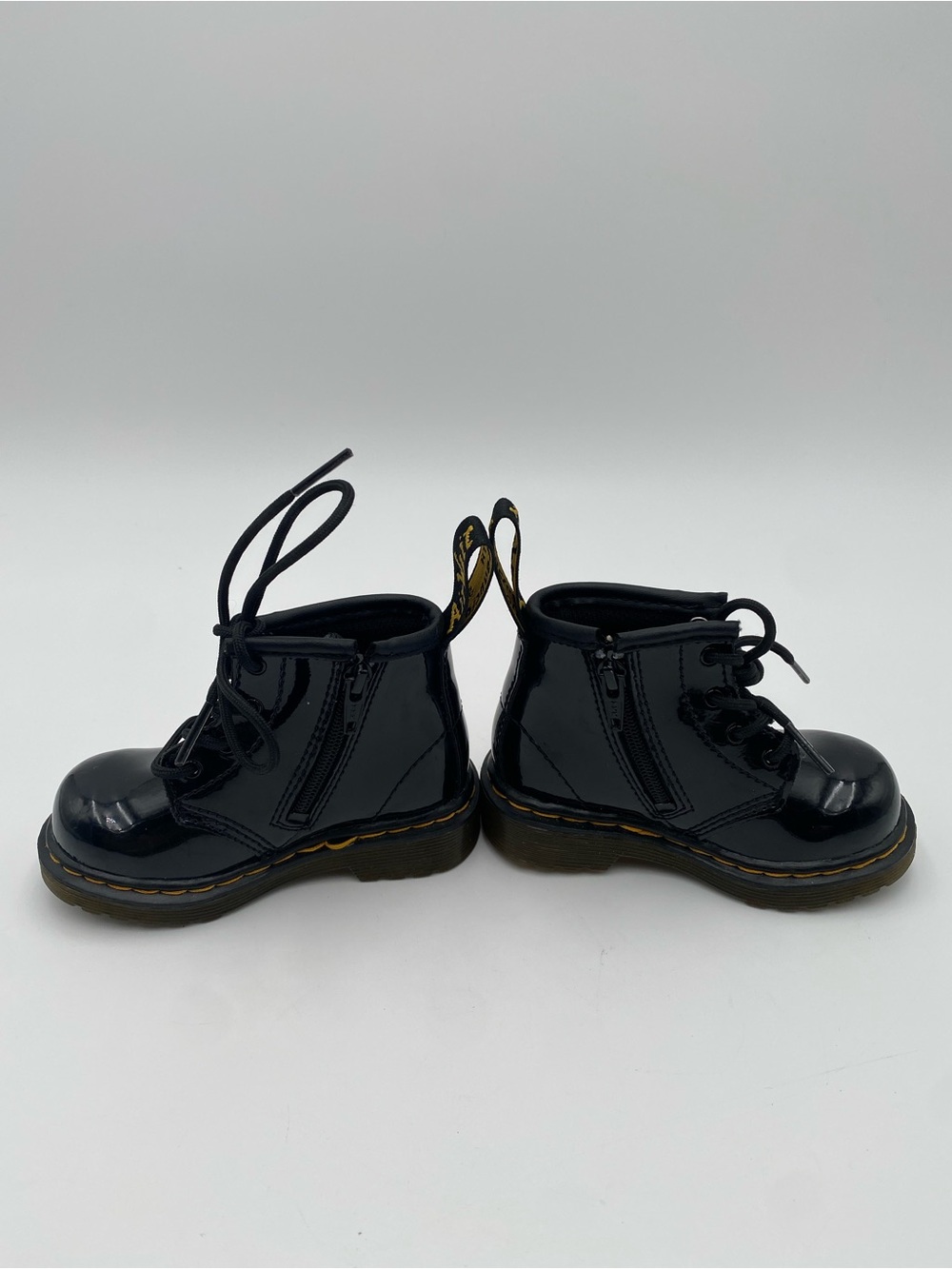 Dr. Martens Kids Black Patent Lace-Up Ankle Boots with Yellow Stitch